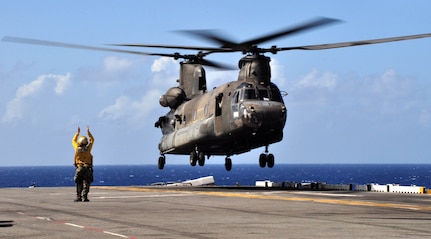 A U.S. Army CH-47 Chinook lands on the flight deck of the U.S.S. Wasp mulitipurpose amphibious assault ship during deck landing qualification training Dec. 8, 2009. Forty-six U.S. Army aircrew members conducted the training with the Chinook and Blackhawk helicopters, staying aboard the Wasp while underway in the Caribbean Sea. (U.S. Air Force photo/Tech. Sgt. Mike Hammond)