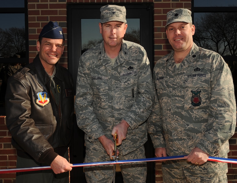 LANGLEY AIR FORCE BASE, Va. --  Col. Matt Molloy, 1st Fighter Wing commander, Col. Gene Kirkland, future 633d Air Base Wing commander, and Lt. Col. Jeffrey Ullmann, 1st Civil Engineer Squadron commander, cut the ribbon of the new 633d ABW building Dec. 9.  The 633d ABW will be holding its activation ceremony Jan. 7.  (U.S. Air Force photo/Senior Airman Zachary Wolf)
