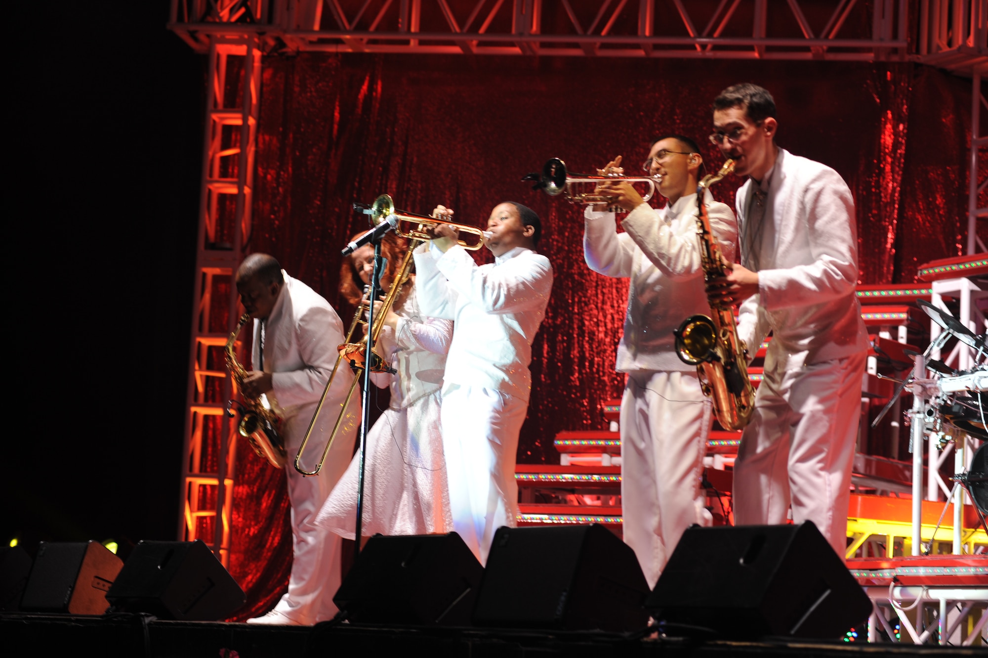 (Second from the right) 1st Lt. Joshua Frilling, 319th Logistics Readiness Squadron, plays the trumpet during a performance with Tops in Blue Dec. 7 at the Charles Fritz Auditorium in Grand Forks, N.D. Lieutenant Frilling is on permissive temporary-duty assignment, while performing with Tops in Blue. Tops in Blue is an all-active duty U.S. Air Force special unit made up of amateur performers selected for their entertainment abilities. (U.S. Air Force photo by Staff Sgt. Suellyn F. Nuckolls)