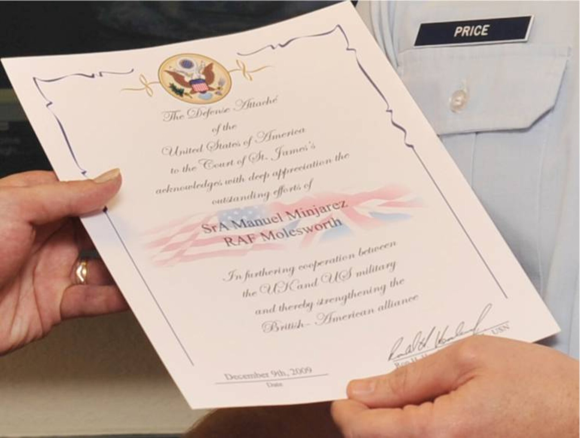 The certificate presented to AFRICOM IKD-Molesworth Senior Airman Manuel Minjarez recognizing his achievements furthering cooperation between the U.S. and U.K. militaries in organizing the Honor Guard presentation at the recent NFL game in London.  U. S. Air Force photo by Staff Sgt. Javier Cruz) 