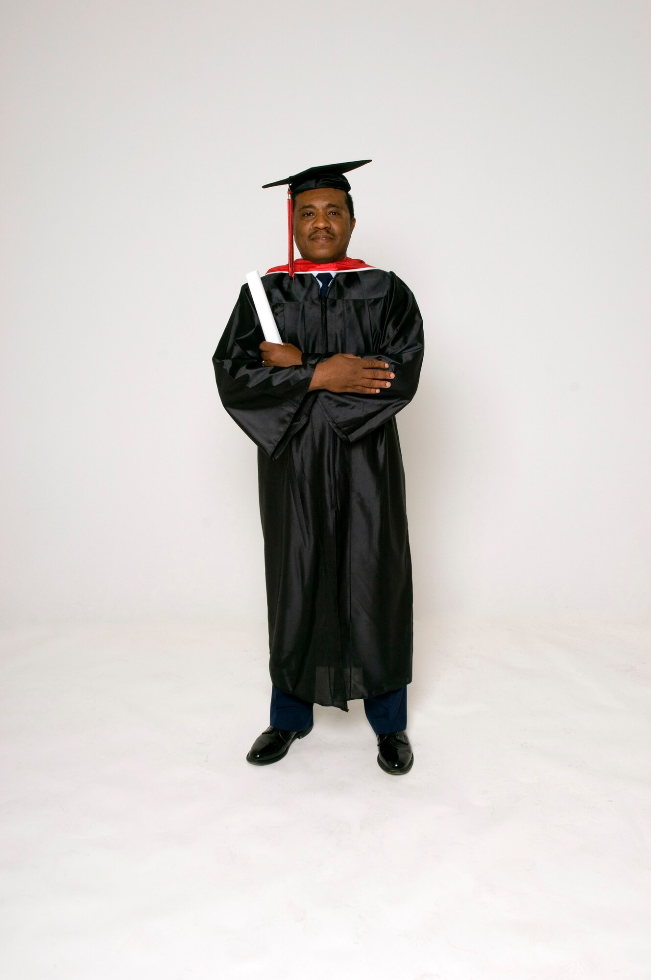 Chief Master Sgt. Nathan Dixon Jr., 412th Maintenance Group superintendent, used his Community College of the Air Force degree as a stepping stone for his educational goal of earning his doctorate of philosophy degree. (U.S. Air Force photo/Edward Cannon)