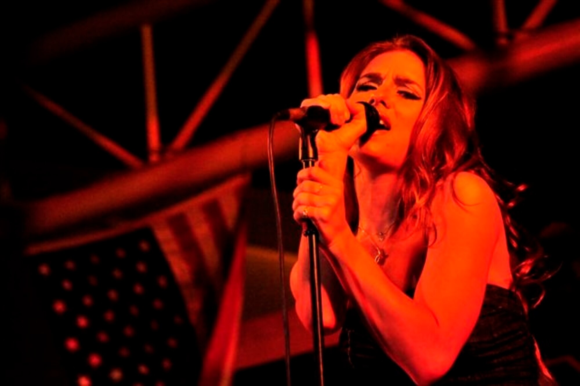SOUTHWEST ASIA—Country-music singer Jesse James, 21, performed at the 380th Air Expeditionary Wing with Tour for the Troops, a crew of artists sponsored by the Air Force Reserve. James has roots in the military, as her father is a colonel in the U.S. Air Force. (U.S. Air Force Photo/Tech Sgt. Charles Larkin Sr)