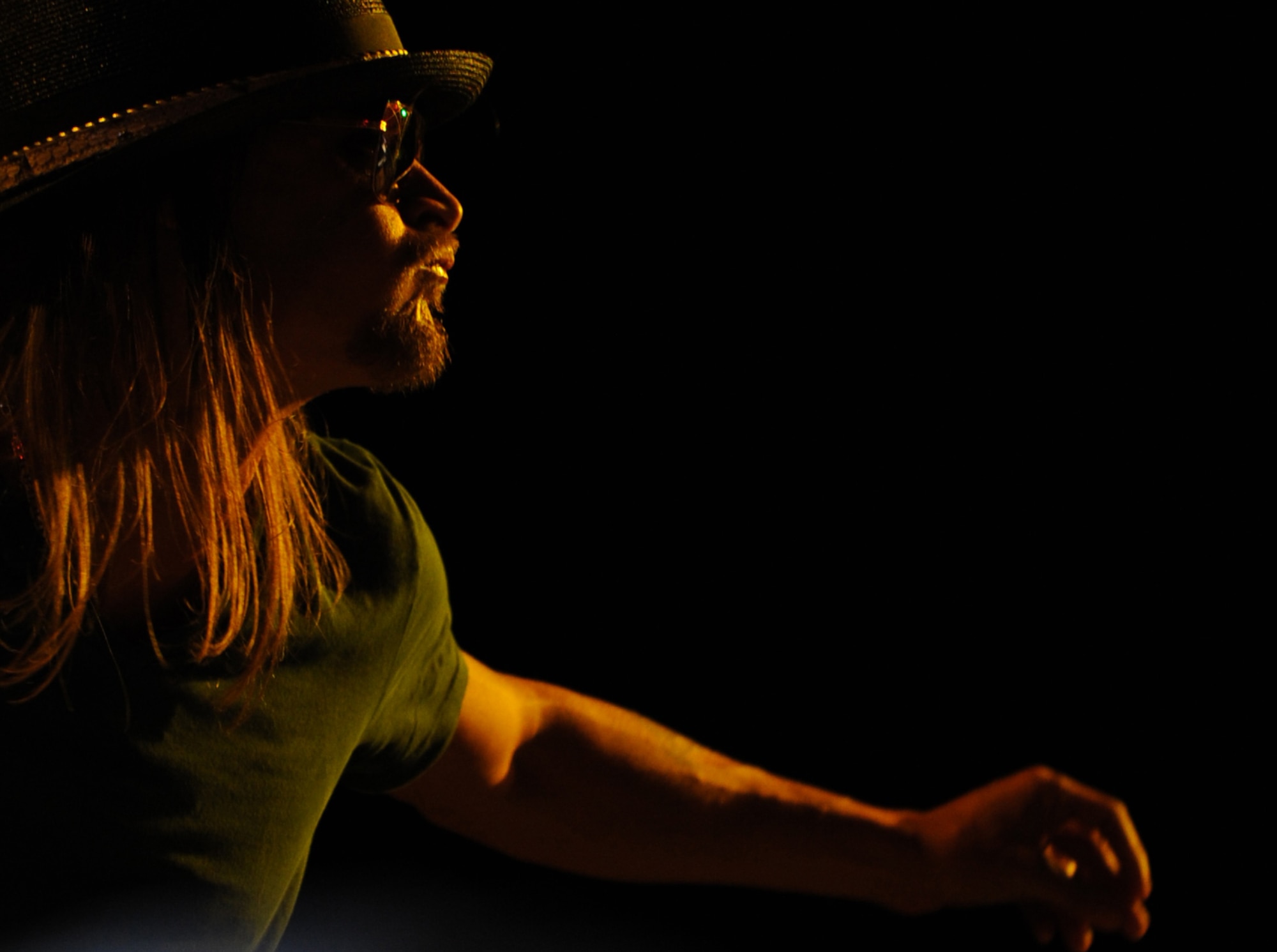 Singer/songwriter Kid Rock performs at the Tour for the Troops 2009 concert inside Hangar 1 at Ramstein Air Base, Germany, Dec. 9, 2009. Singer/songwriter Jessie James, comedian Carlos Mencia and Kid Rock, along with the Twisted Brown Trucker Band, performed for Kaiserslautern Military Community members and their families to thank the troops and increase morale during the holiday season. (U.S. Air Force photo by Airman 1st Class Caleb Pierce)