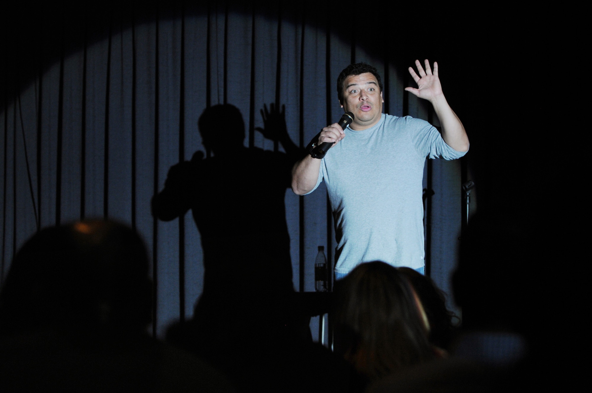Comedian Carlos Mencia, known for his show "Mind of Mencia," performs an adult stand-up comedy routine for more than 250 people at the Officer's Club, Dec. 9, 2009, Ramstein Air Base, Germany.  Mr. Mencia is part of Tour for the Troops 2009, traveling to overseas bases and entertaining servicemembers and their families.  (U.S. Air Force photo by Tech. Sgt. Chenzira Mallory)