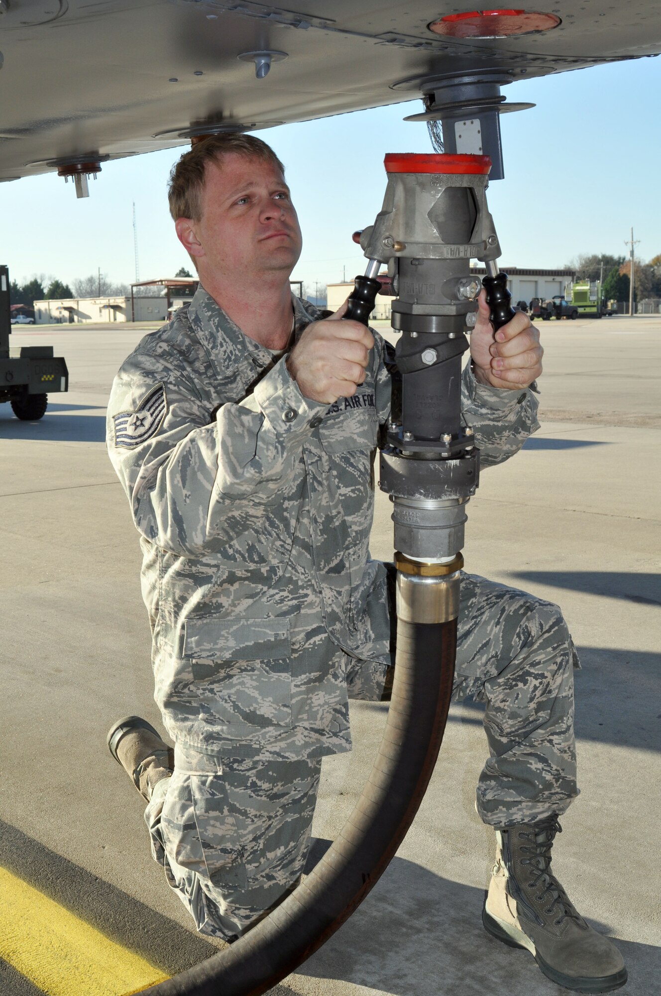 Tech. Sgt. Jason Kennedy, a fuels technician for the 917th Logistics Readiness Squadron on Barksdale Air Force Base, La., prepares to fuel up a B-52 Stratofortress by attaching a single point line to the aircraft during his unit training assembly weekend. Sergeant Kennedy, who is originally from Whitehouse, Texas, has spent over 14 years in the Air Force, initially joining for educational opportunities. The technician’s favorite thing about working in the 917th LRS fuels shop is getting the opportunity to see every plane that the United States Air Force has in its inventory. He also works with the person who has influenced his military career the most, Master Sgt. Terry Miller, a fuels manager for the 917th LRS. Sergeant Miller always strives to be the best at his job and he pushes the rest of his shop to do the same, said Sergeant Kennedy. When Sergeant Kennedy isn’t working he enjoys golfing on local courses with his co-workers.  (U.S. Air Force photo/Airman 1st Class Crystal Jordan)                                 