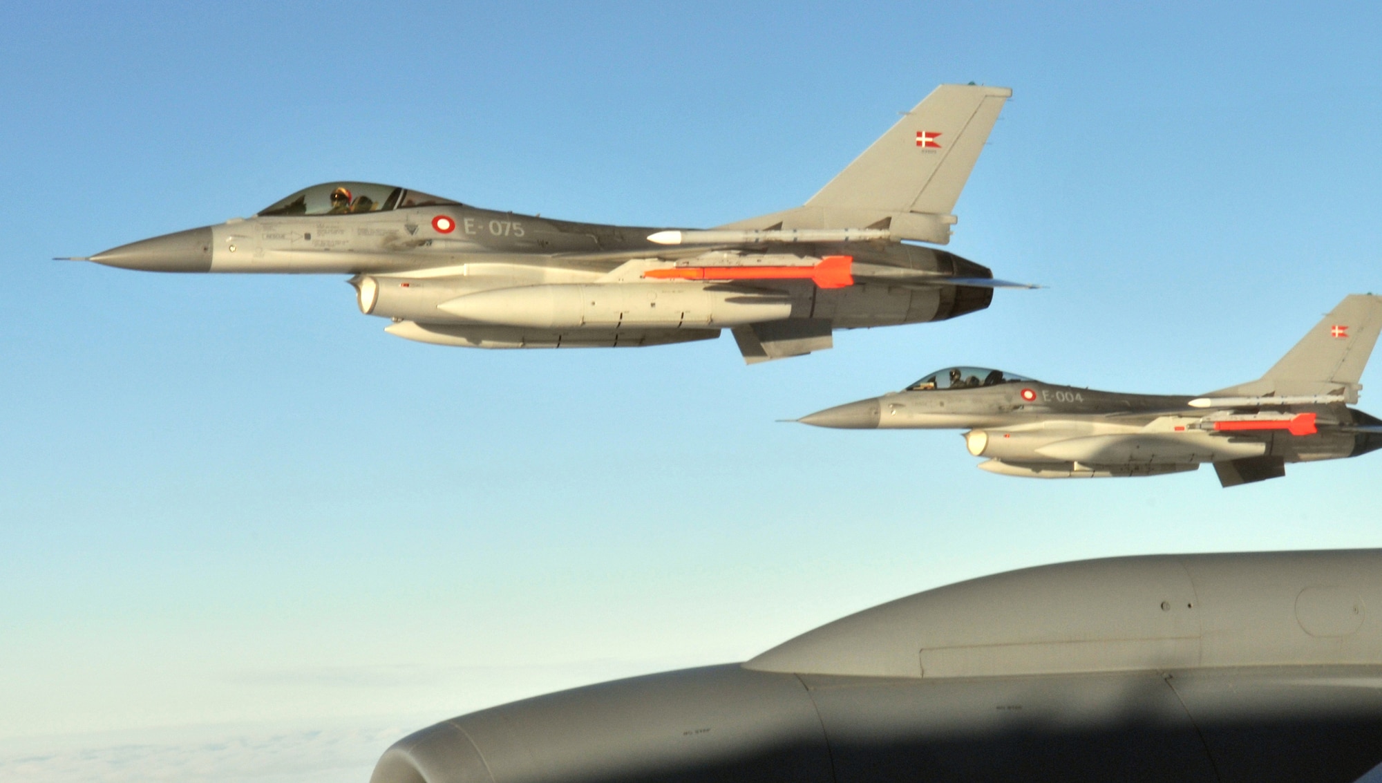 Santa flies his ?sleigh? in formation with a Royal Danish Air Force F-16 Fighting Falcon fly off the wing of a KC-135 Stratotanker during a refueling mission over their homeland Dec. 8. In all, the RAF Mildenhall-based Stratotanker refueled 30 aircraft and pumped more than 40,000 tons of fuel. (U.S. Air Force photo/Tech. Sgt. Kevin Wallace)