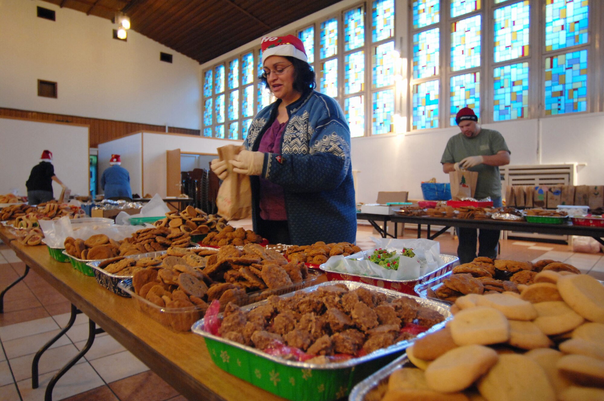 Ramstein Officer Spouses Club member Nancy Banik stuffs cookies into bags destined for single servicemembers living in the dormitories on Vogelweh and Ramstein Air Base, Dec. 10, 2009. The Ramstein Officer Spouses Club together with the Kaiserslautern Spouses Association and the Ramstein Enlisted Spouses Association collected more than 12,000 cookies to give to the more than 11,000 Airman who live in the dorms at the bases. (U.S. Air Force photo by Tech. Sgt. Michael Voss)
 