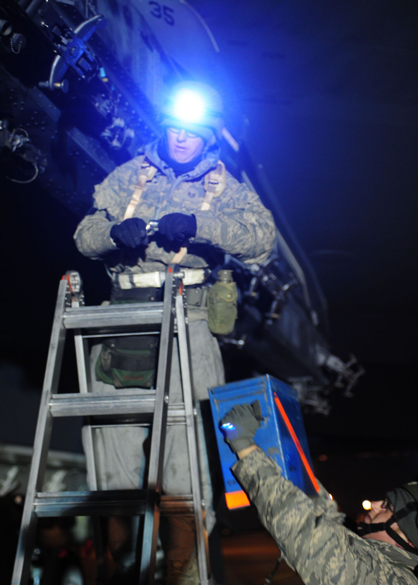 Airmen prepare pylons to load weapons on a B-52 at Base X, a simulated forward operating location, during Barksdale’s conventional readiness inspection Dec. 8. (U.S. Air Force photo by Staff Sgt. Sarah E. Stegman)(RELEASED)