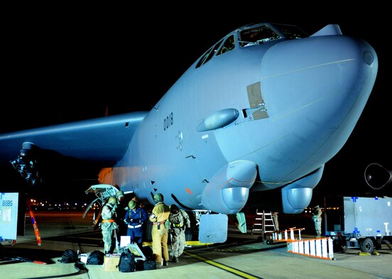 Maintainers gather in front of a B-52 at Base X at the beginning of their shift Dec. 8.  Airmen at the simulated forward operating location on base were tasked to re-generate aircraft as part of a conventional operational readiness inspection. (U.S. Air Force photo by Staff Sgt. Sarah E. Stegman)(RELEASED)