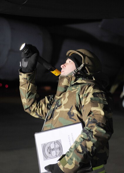 Staff Sgt. Steven Cradic, 2d Maintenance Squadron quality assurance, looks for lose or missing rivets on a B-52H Stratofortress here Dec. 8.  Sergeant Cradic was deployed to Base X, a simulated forward operating location, during Barksdale’s conventional readiness inspection. (U.S. Air Force photo by Staff Sgt. Sarah E. Stegman)(RELEASED)