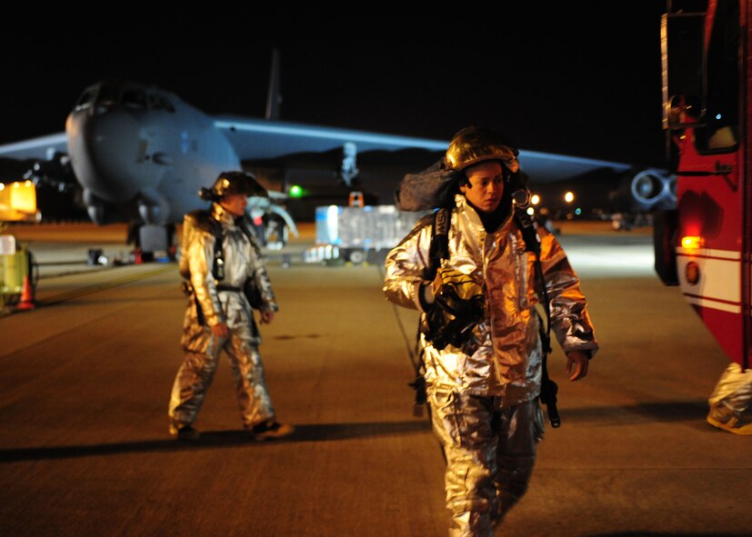 Airman Martin Apodaca, 2d Civil Engineer Squadron, returns to his fire truck after responding to a ground emergency at Base X during a conventional operational readiness inspection here Dec. 8.  Barksdale is currently undergoing an Air Combat Command inspection to generate aircraft and rapidly deploy its personnel and assets. (U.S. Air Force photo by Staff Sgt. Sarah E. Stegman)(RELEASED)