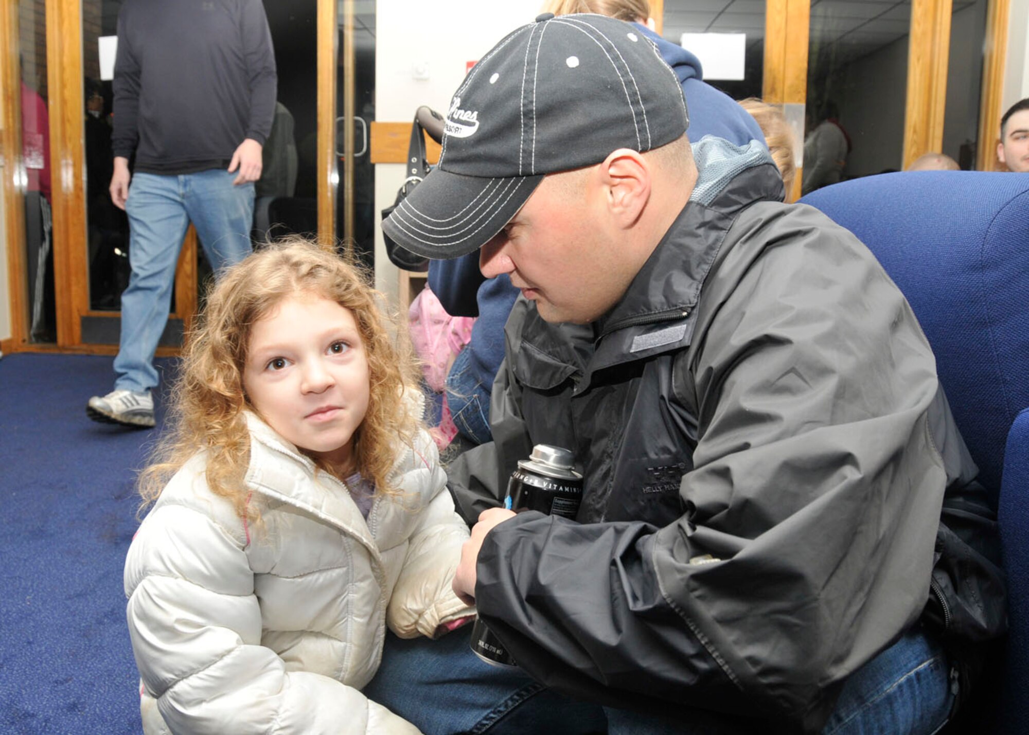 Staff Sgt. Norman Heffle, 48th Security Forces Squadron member, spends time with his daughter Brooklynne, 5, before leaving on deployment at RAF Lakenheath, England, Dec. 9.  Sergeant Heffle is part of a team of approximately 40 security forces members deploying to Southwest Asia.  (U.S. Air Force photo/Airman 1st Class Eboni Knox