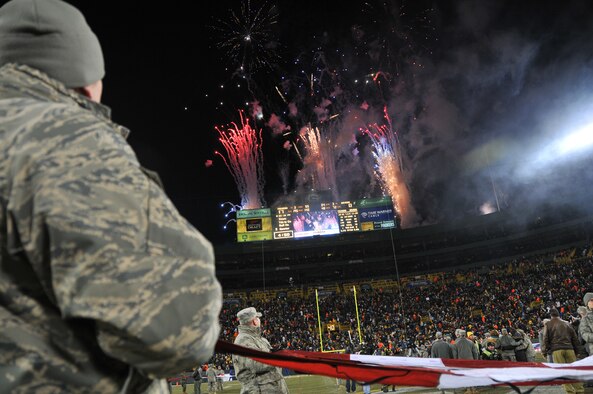 The Green Bay Packers honored military families during their recent Monday Night Football game against the Baltimore Ravens. The Murray family was recognized at half-time on the 50-yard line at Lambeau Field and was surprised by a personal message from Lt. Col. David Murray, a nurse practitioner with the 115th Medical Group deployed to Balad Air Base, Iraq as a flight commander of the intermediate care ward at the Balad Theatre Hospital. Senior Master Sgt. Val Chandler and Tech. Sgt. Zach Brewer, 115th Fighter Wing recruiters, participated in the ceremony on the field as well. (U.S. Air Force photo by Tech. Sgt. Don Nelson)