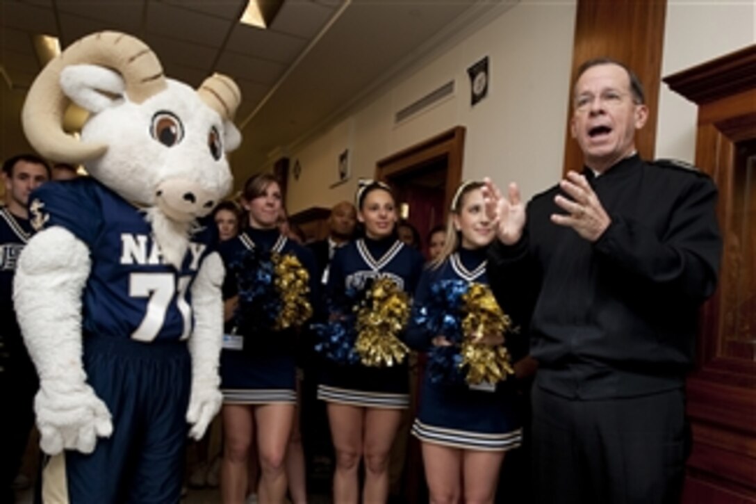 Chairman of the Joint Chiefs of Staff Adm. Mike Mullen, U.S. Navy, greets the U.S. Naval Academy Midshipmen Pep Band during their rally in the corridors of the Pentagon on Dec. 10, 2009.  The Midshipmen take on the U.S. Military Academy in their 103rd annual football game on Saturday in Philadelphia.  