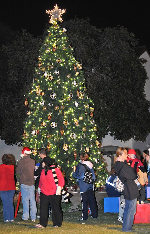 Fort McArthur’s holiday tree illuminates the night during the annual Tree Lighting Ceremony, Dec. 4. Other festivities included a visit from Santa, snow day with children's play area covered with more than 20 tons of man-made snow, two 50-ft. sled runs and a holiday story reading by Col. Anita Latin, 61st Air Base Wing commander. (Photo by Atiba S. Copeland)