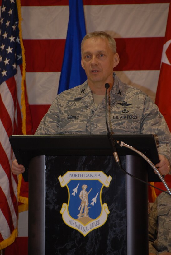 Col. Rick Gibney speaks to the Airmen of the North Dakota Air National Guard during a Change of Command Ceremony that took place at the 119th Wing on Dec. 5th.  Col. Robert Becklund relinquished command of the 119th Wing to Col. Rick Gibney during the ceremony.