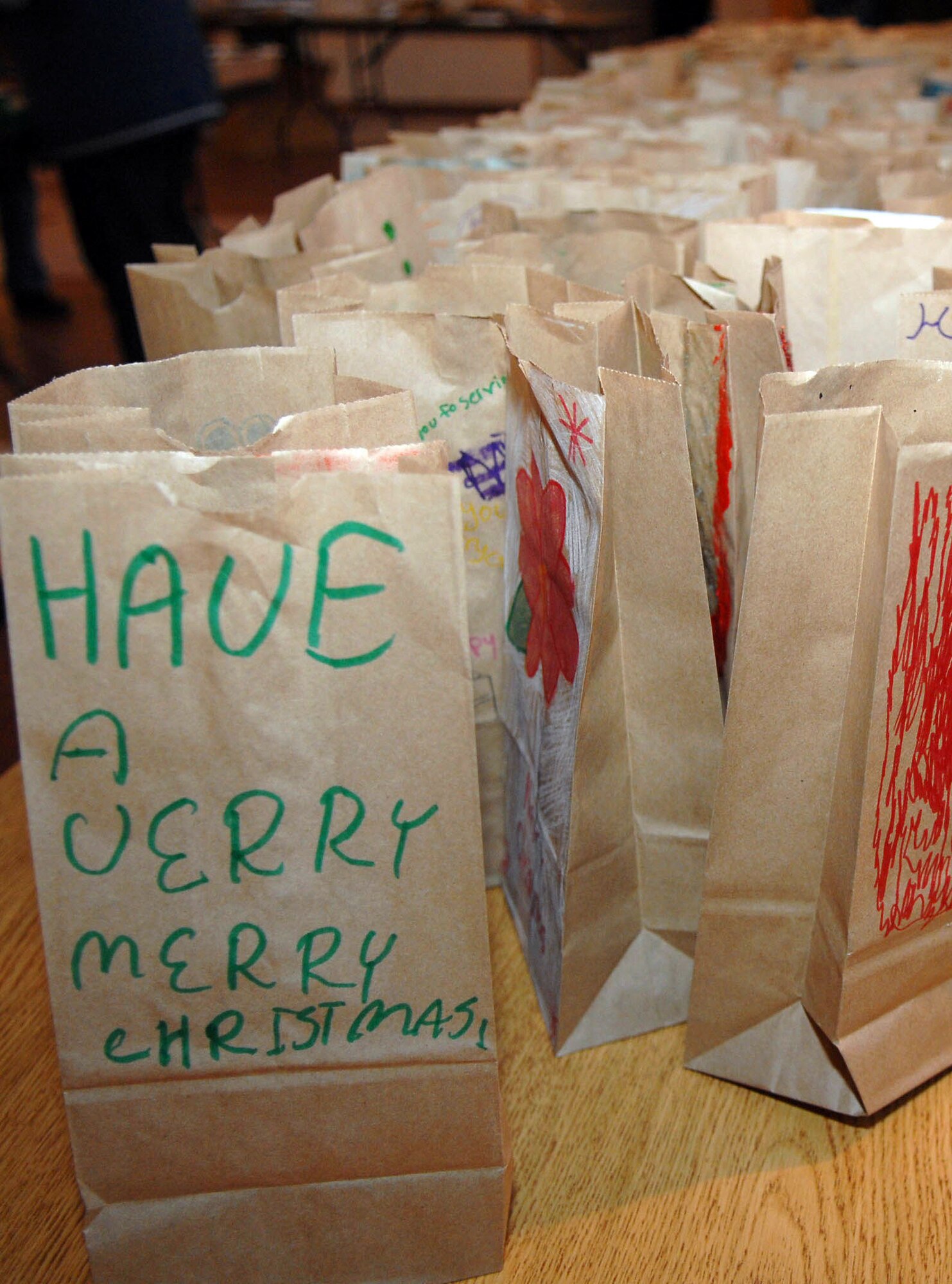 Bags with cookies sit atop a table in the North Side Chapel, Ramstien Air Base, Germany. The bags are destined for single servicemembers living in the dormitories on Vogelweh Military Complex and Ramstein Air Base, Dec. 10, 2009. The Ramstein Officer Spouses Club together with the Kaiserslautern Spouses Association and the Ramstein Enlisted Spouses Association collected more than 12,000 cookies to give to the more than 11,000 Airman who live in the dorms at the bases. (U.S. Air Force photo by Tech. Sgt. Michael Voss)
 