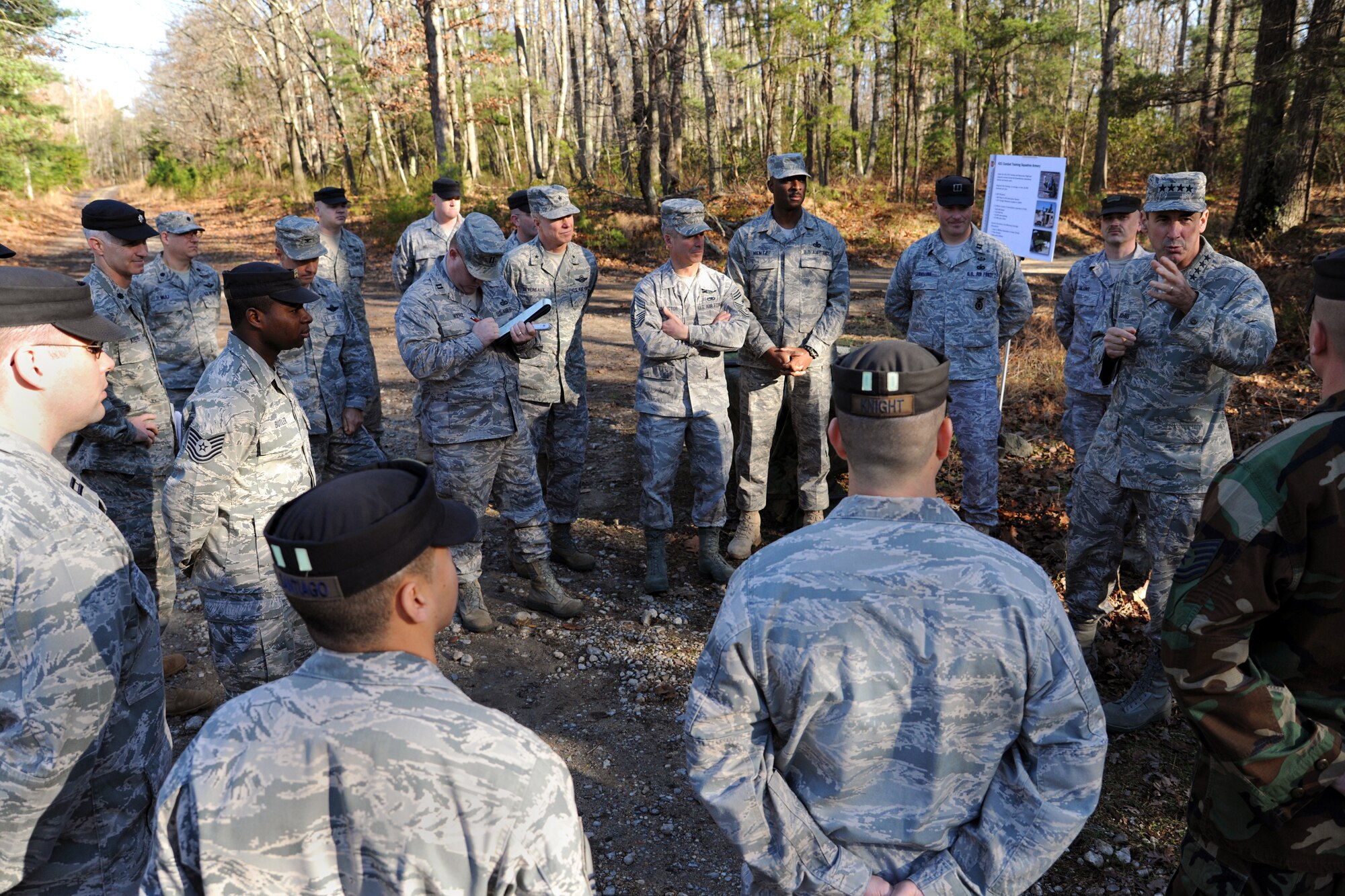 Gen. Raymond Johns Jr., Air Mobility Command commander, speaks with members of the 421st Combat Training Squadron on a Fort Dix range during a visit December 3 to the U.S. Air Force Expeditionary Center on Joint Base McGuire-Dix-Lakehurst.  (U.S. Air Force Photo/Staff Sgt. Nathan G. Bevier) 