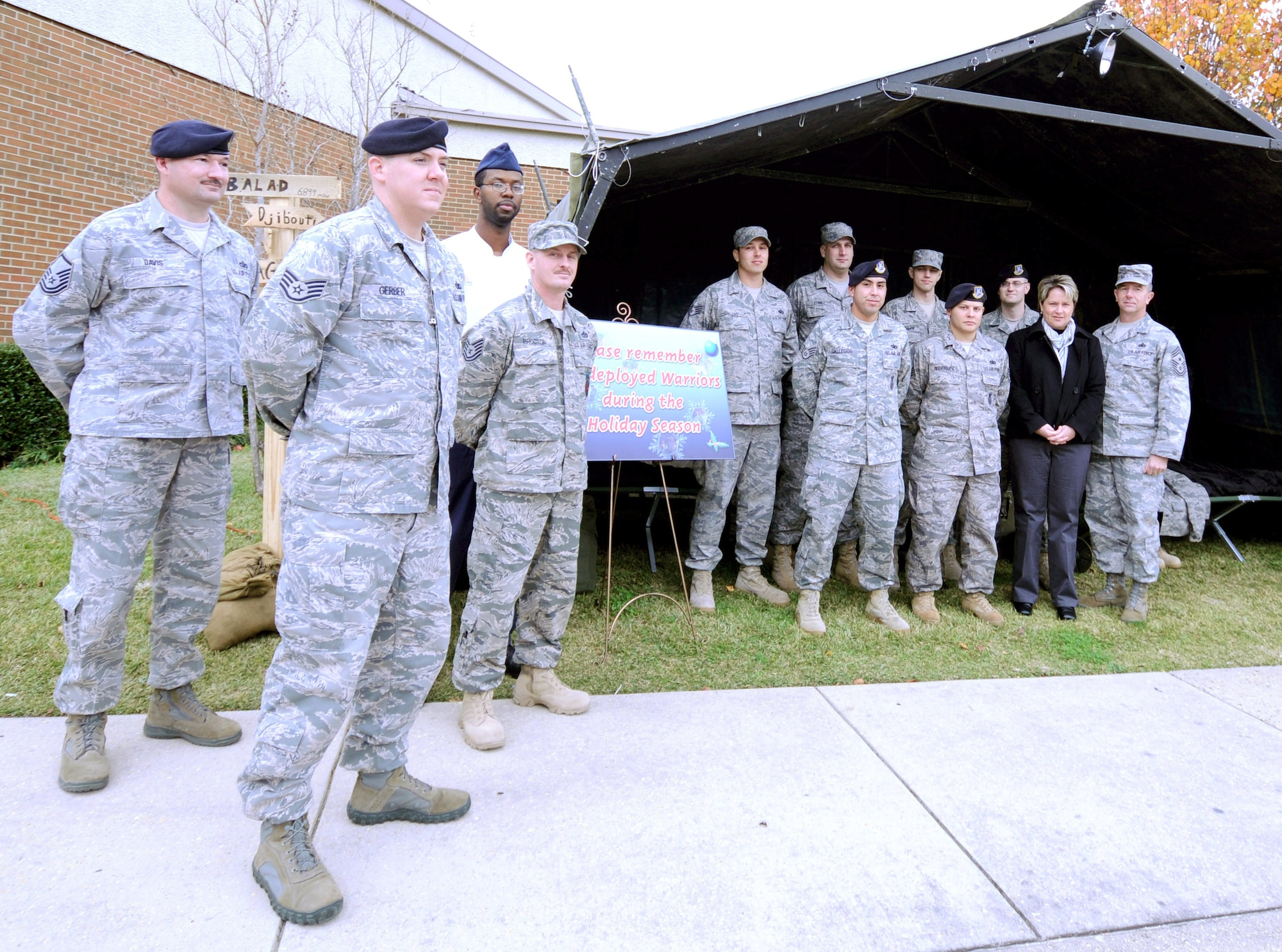 EGLIN AIR FORCE BASE, Fla. - Chief Master Sgt. Thomas Westermeyer, Command Chief, reminds people to remember our Team Eglin Warriors who are deployed during the holidays. As we enjoy this holiday season, let's remember that our family extends beyond those in our homes. Airmen united to build a tent in front of the Officers' Club and fill it with cots and other deployment items to give people perspective on the lives of the Warriors downrange. Tech. Sgt. Christopher Proctor, 96th Civil Engineer Squadron, and Staff Sgt. Scott Gerber, 96th Security Forces Squadron, will deploy while Staff Sgts. Wendell Bowles and Chris Hart, 96th Force Support Squadron, Staff Sgt. Gilbert Galeegos, 96th SFS, Staff Sgt. Jason Edney, 96th CES, and Senior Airman Lindsay Jordan, 96th CES, have just returned from overseas deployments. Master Sgt. Stevean Davis, 96th SFS, and Senior Airman Zachary Douglas, 96th SFS, helped other volunteers set up the tent. (U.S. Air Force photo/Staff Sgt. Stacia Zachary)