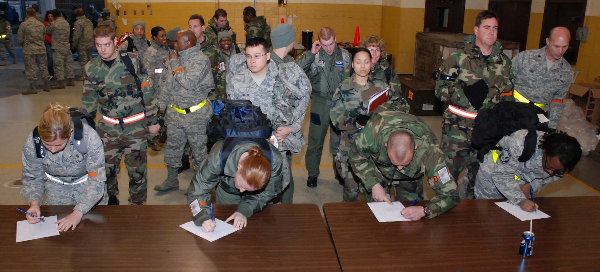 Airmen from the 94th Civil Engineering Squadron, the 94th Aeromedical Evacuation Squadron and the 94th Aeromedical Staging Squadron, sign in for accountability after redeploying from the ORI deployment to Gulfport, Miss.  (U.S. Air Force photo/Master Sgt. Stan Coleman)

