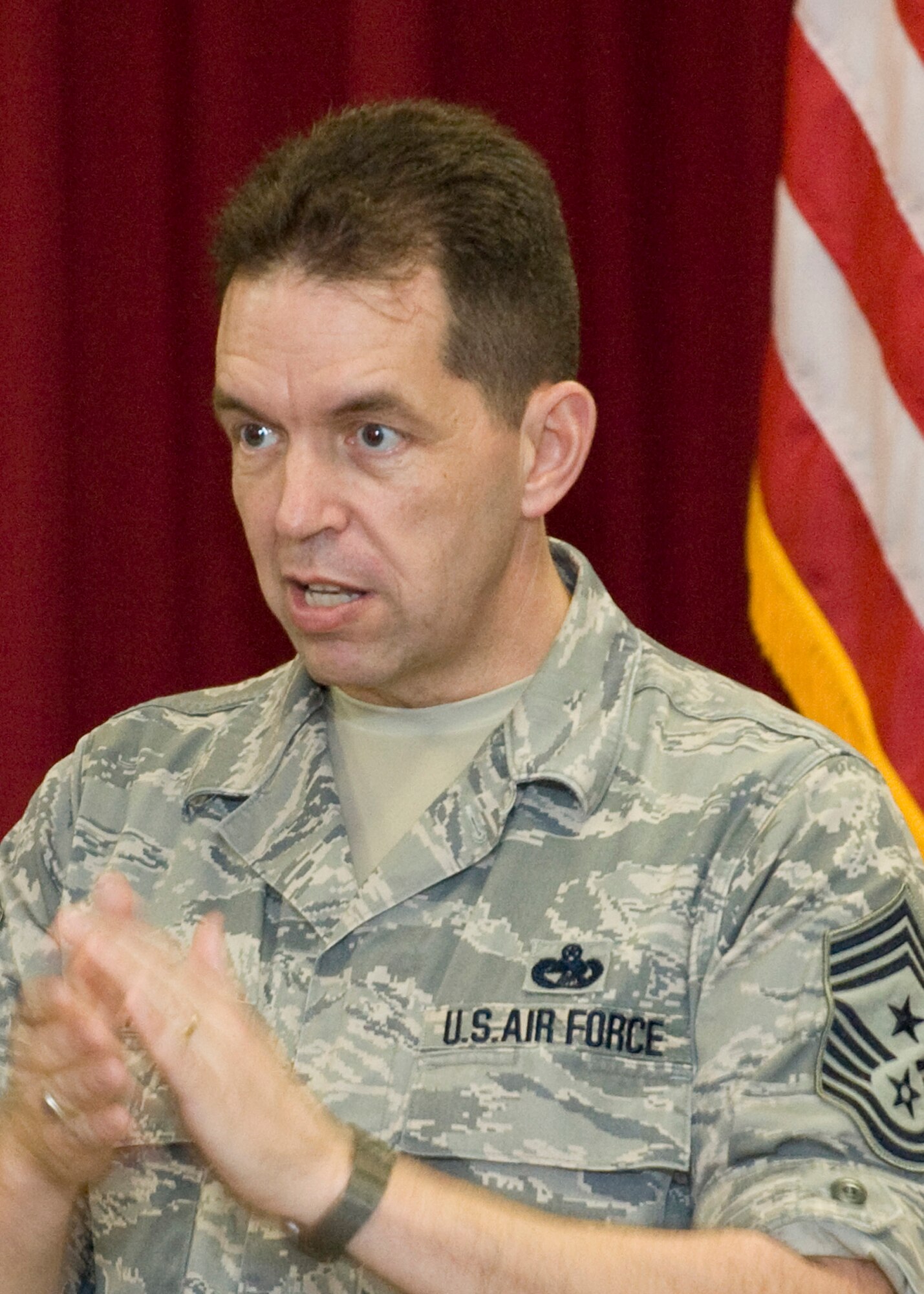 Chief Master Sgt. Robert Tappana, command chief master sergeant of Air Education and Training Command, speaks to more than 40 personnel of the 33rd Fighter Wing, Dec. 9 during a joint enlisted call. The chief toured 33rd FW facilities and later spoke at the Eglin Airmen Leadership School graduation during his visit to the base. (Air Force photo/Deb Haussermann). 