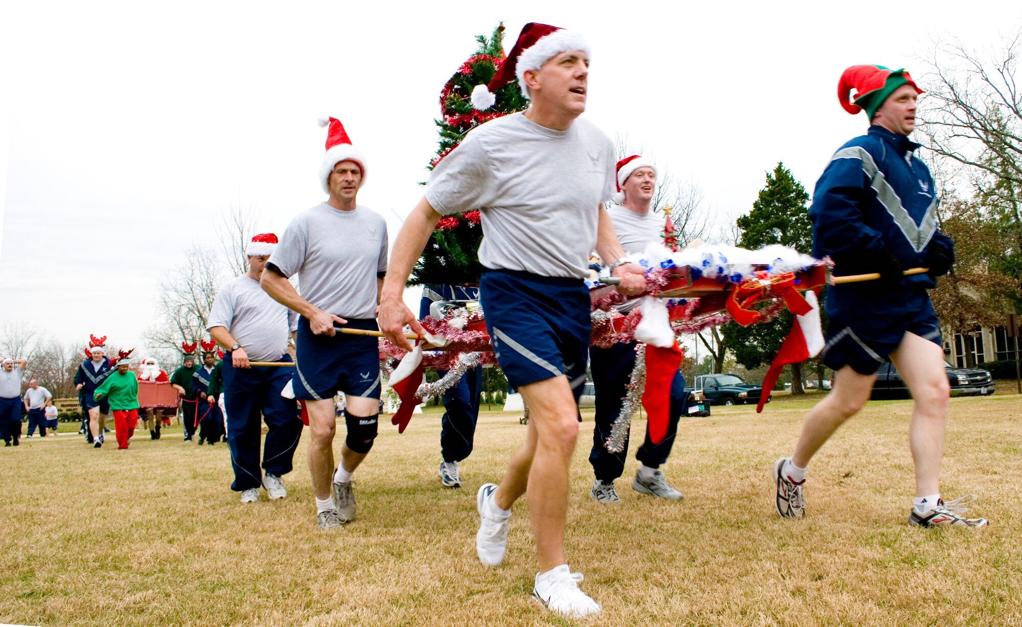 More than 350 members of Team Pope dressed in holiday attire and PT gear gathered to run a 1.1-mile course in order to inspire members to give to the Angel Tree Program. The Angel Tree program assists Team Pope families during the holidays. (Photo by Dawn Elizabeth Pandoliano) 