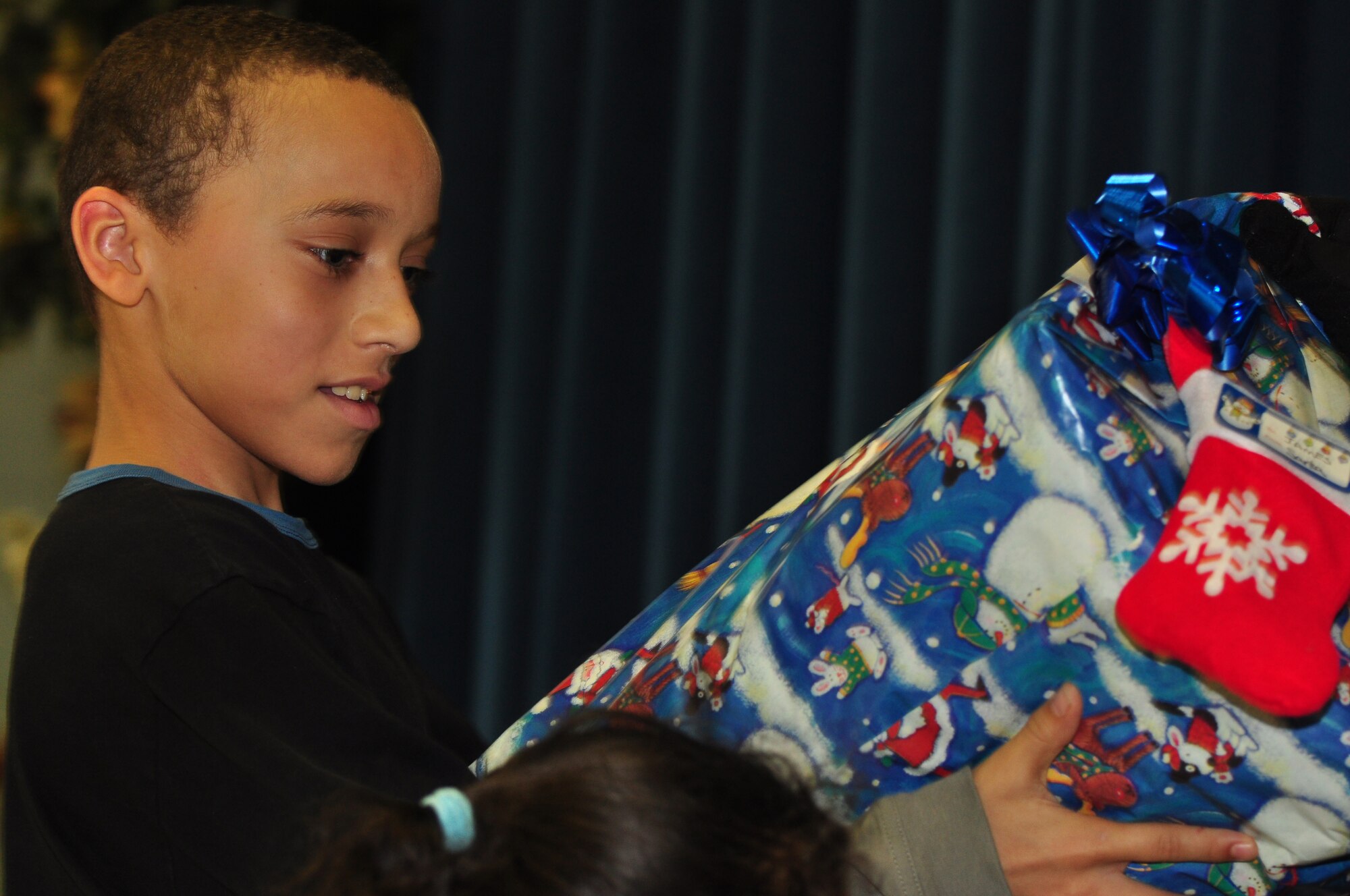 Pope Airmen hosted a Christmas party for children from the Falcon Children’s Home Dec. 5. The children played basketball at the base fitness center and danced in the Pope Elementary School. They were treated to lunch, arts and crafts, games and a visit from Santa complete with gifts. (U.S. Air Force photo by Tech. Sgt. Steven Kennedy)