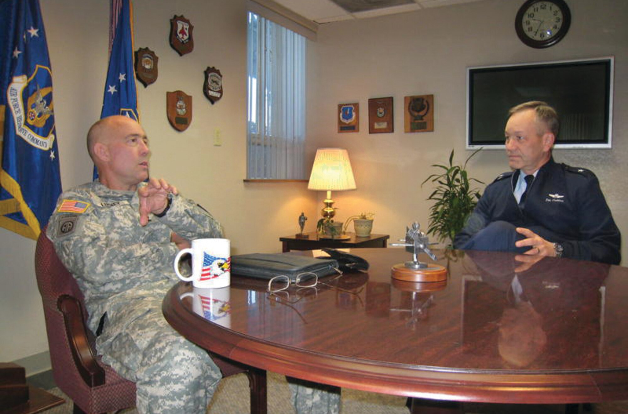 Maj. Gen. Charles D. Luckey, Assistant to the Chairman, Joint Chiefs of Staff for Reserve Matters, left, discusses Reserve member challenges with Brig. Gen. Eric W. Crabtree, Fourth Air Force Commander at March ARB, during his visit last week. Besides Fourth Air Force, General Luckey visited the 452nd Air Mobility Wing, 163rd Reconnaissance Wing, 358th Civil Affairs Brigade, 304th Sustainment Brigade, Navy Operational Support Center-Moreno Valley as well as the Air and Marine Operations Center. He met with civic leaders from Moreno Valley during lunch and was hosted by The Greater Riverside Chambers of Commerce in the evening. Also, General Luckey welcomed home a plane load of Marines returning from overseas and, on a sobering note, he attended the return of a Fallen Soldier, Pfc. Marcus A. Tynes of Moreno Valley, and met with his family.  (U.S. Air Force photo by 1st Lt. Zachary L. Anderson)