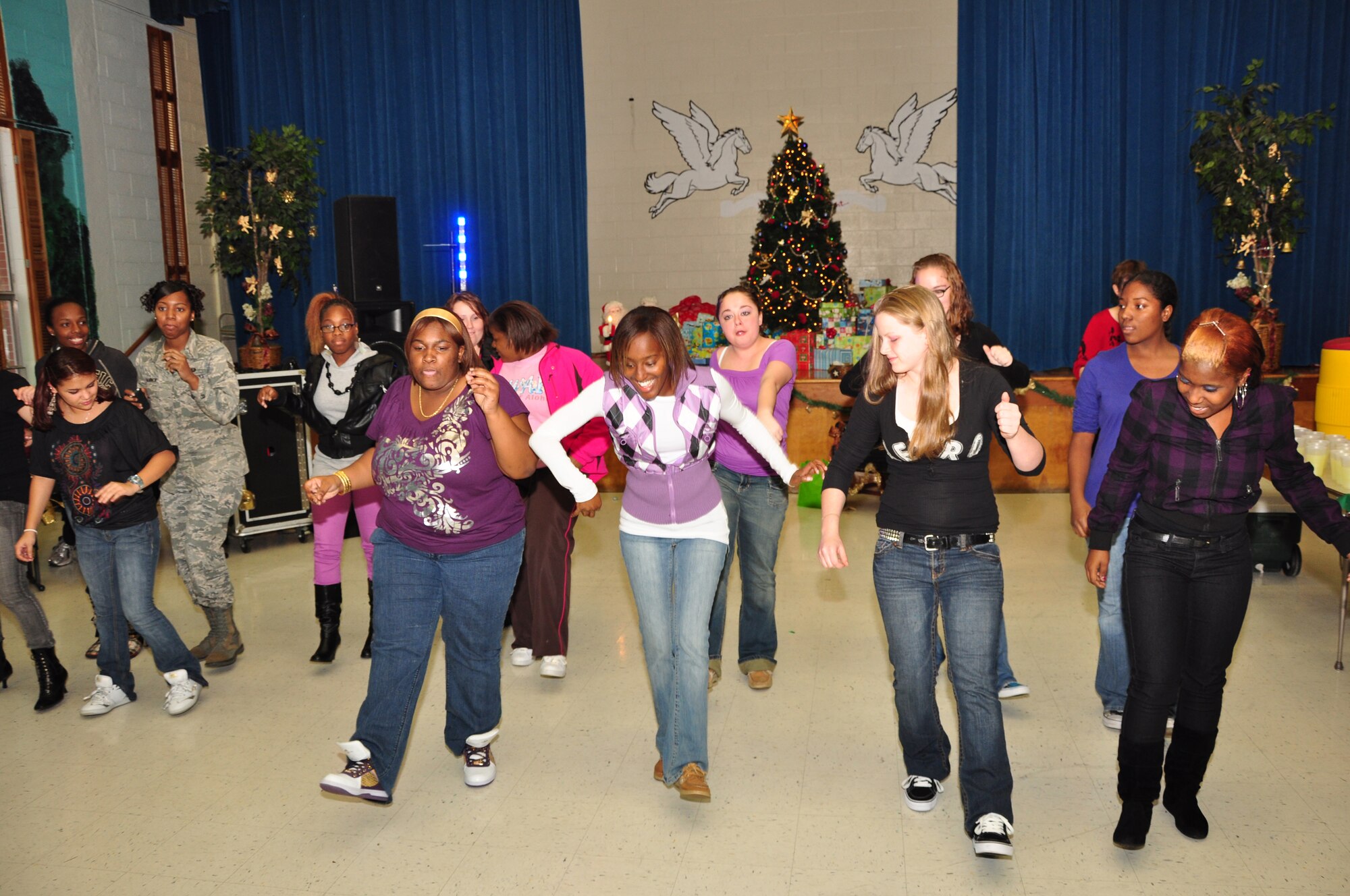 Pope Airmen hosted a Christmas party for children from the Falcon Children’s Home Dec. 5. The children played basketball at the base fitness center and danced in the Pope Elementary School. They were treated to lunch, arts and crafts, games and a visit from Santa complete with gifts. (U.S. Air Force photo by Tech. Sgt. Steven Kennedy)