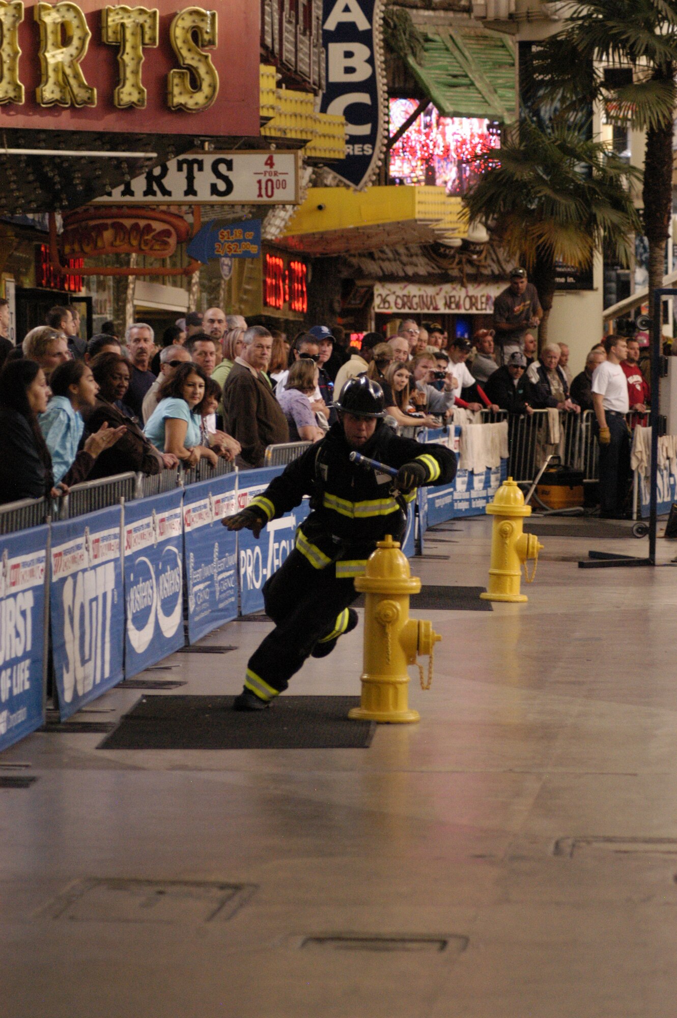LAS VEGAS -- Airman 1st Class Jacob Ross, 21st Civil  Engineer Squadron firefighter, runs through a serpentine course during the 2009 Firefighter Combat Challenge Nov. 16 to 20 in Las Vegas. Team Pete was named the Rookie of the Year Team in its first full year of competing in the annual event. The challenge attracts hundreds of U.S. and Canadian firefighters to a competition which demonstrates firefighters’ fitness and the rigors of the profession. Wearing full bunker gear, firefighters race head-to-head performing five tasks including climbing a five-story tower, hoisting, chopping, dragging hoses and rescuing a life-size 175 pound “victim.” (Air Force photo by John Van Winkle)