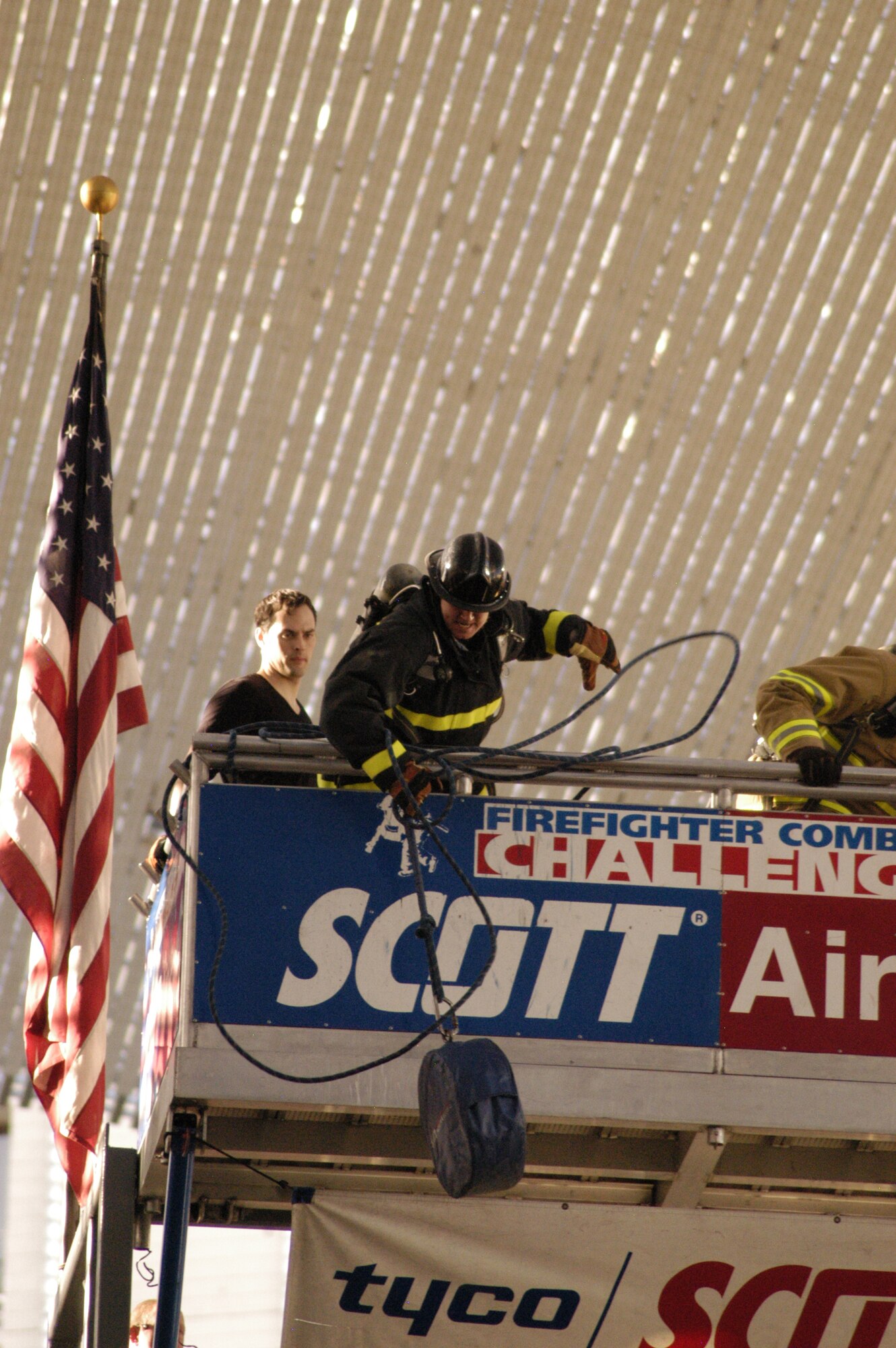 LAS VEGAS -- Staff Sgt. Brian Burmeister, 21st Civil Engineer Squadron firefighter, pulls up a rolled hose during the 2009 Firefighter Combat Challenge Nov. 16 to 20 in Las Vegas. Team Pete was named the Rookie of the Year Team in its first full year of competing in the annual event. The challenge attracts hundreds of U.S. and Canadian firefighters to a competition which demonstrates firefighters’ fitness and the rigors of the profession. Wearing full bunker gear, firefighters race in relays and in tandem head-to-head performing five tasks including climbing a five-story tower, hoisting, chopping, dragging hoses and rescuing a life-size 175 pound “victim.” (Air Force photo by John Van Winkle)