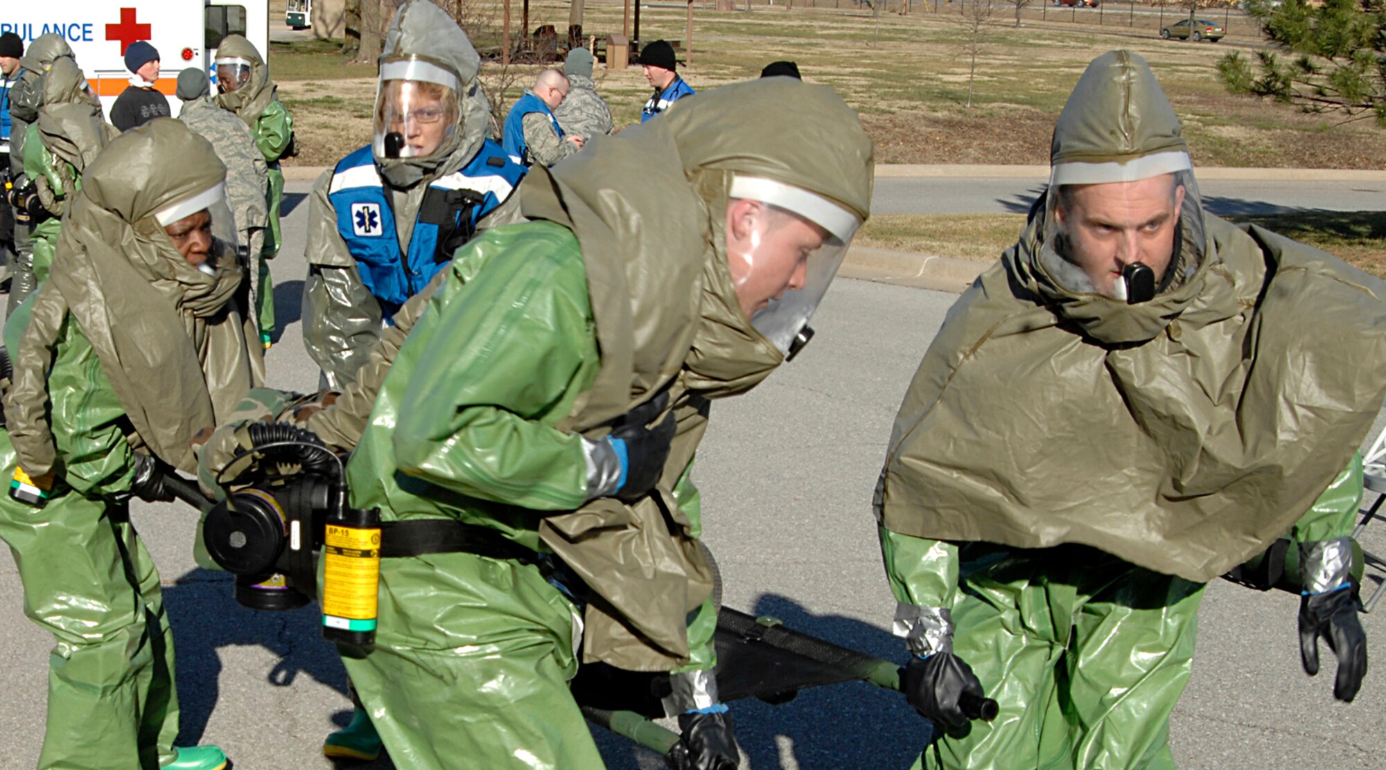 Airmen from the 22nd Medical Group transport an “attack victim” on a gurney, during a medical response exercise, Dec. 2, 2009, at McConnell Air Force Base, Kan. Base medical personnel and other first responders reacted to a simulated chemical attack,  and took victims through a decontamination process before providing medical treatment. (U.S. Air Force Photo/Airman 1st Class Justin Shelton)