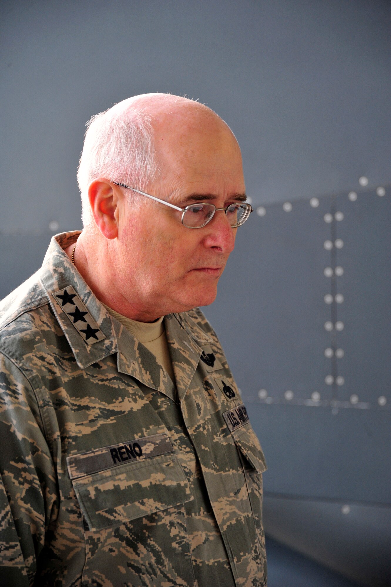 SOUTHWEST ASIA - Lt. Gen. Loren Reno, Deputy Chief of Staff for Logistics, Installations and Mission Support, reads a storyboard during a briefing from the 380th Air Expeditionary Wing, regarding upcoming base projects Dec. 10, 2009. General Reno visited each of the aircraft maintenance squadrons before holding an Airman's call to answer questions. (U.S. Air Force photo/Tech. Sgt. Charles Larkin Sr)