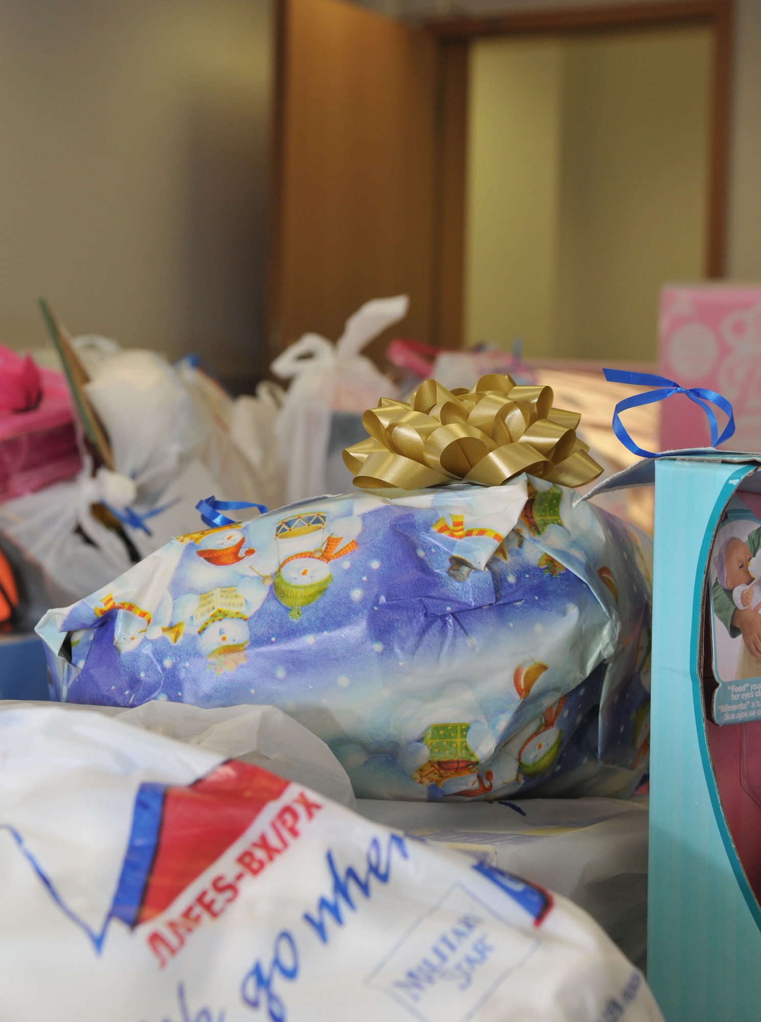 SPANGDAHLEM AIR BASE, Germany -- As of Dec. 9, the wing raised about $900 for approximately 60 children from 26 families through the Angel Tree Program. About 130 presents were purchased with donated money from members of the community. The program provides gifts to children of servicemembers who need extra assistance during the holidays. Donations are being collected from the Spangdahlem and Bitburg Base Exchanges through Dec. 12. (U.S. Air Force photo/Airman 1st Class Nick Wilson)