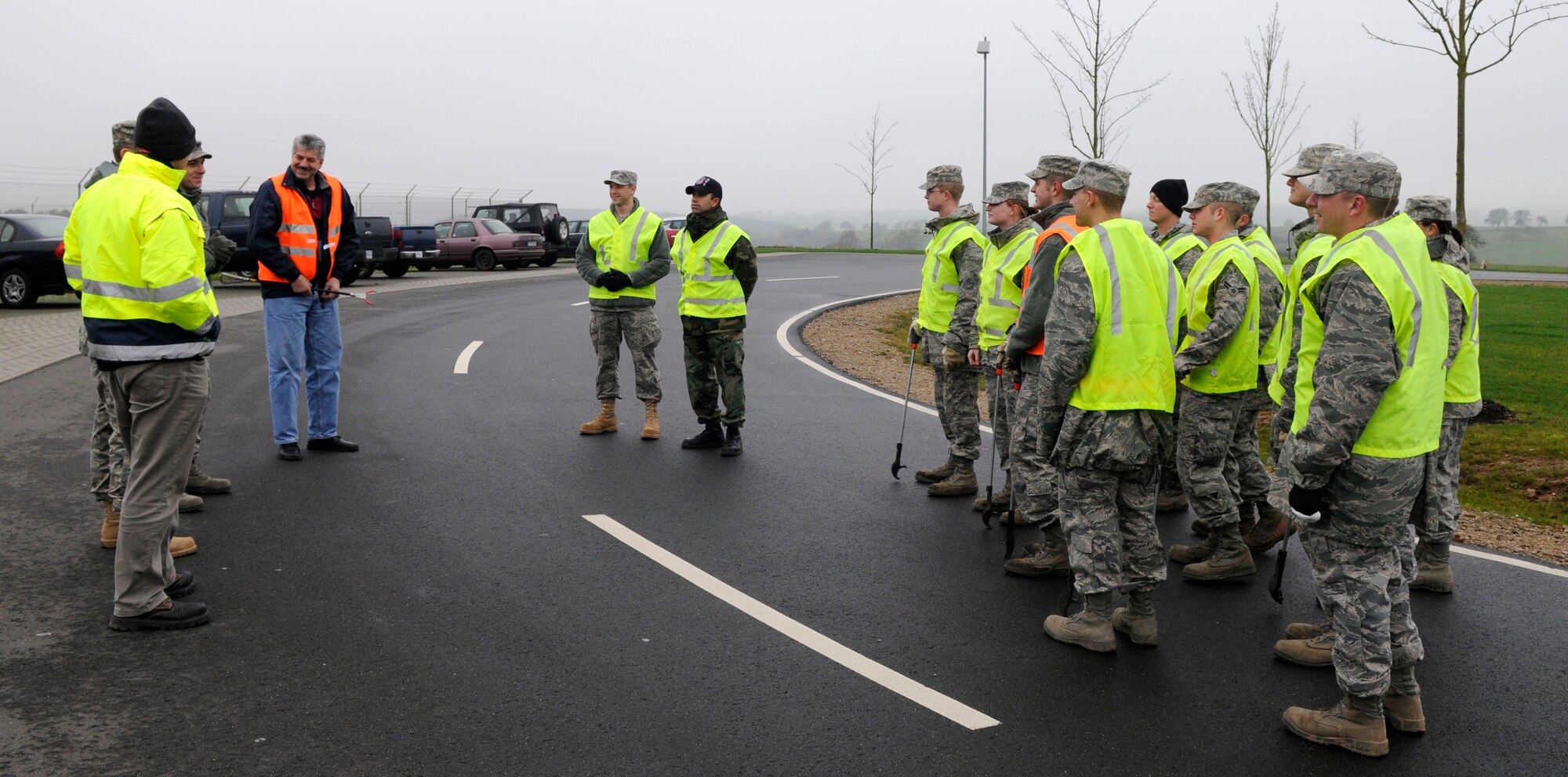 SPANGDAHLEM AIR BASE, Germany –Klaus Rodens, Spangdahlem mayor, meets with Eifel Pride Airmen from 52nd Civil Engineer Squadron to clean along the L-46 Dec 8. Eifel Pride will now perform trash clean-up along L-46 between the main gate and gate 2 on a monthly basis. (U.S. Air Force photo/Airman 1st Class Staci Miller)
