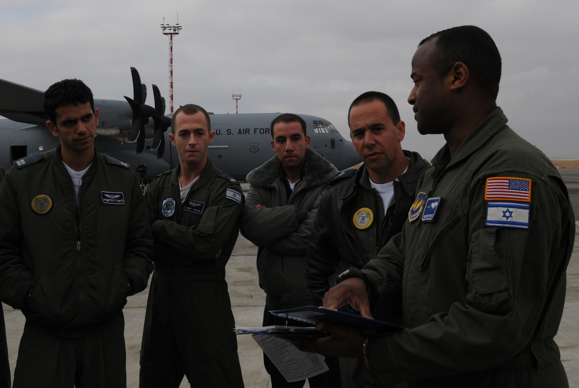 U.S. Air Force Master Sgt. Greg Everett, 37th Airlift Squadron loadmaster, briefs the Israeli Air Force loadmaster on the new C-130J Super Hercules aircraft, Dec. 9, 2009, Nevatim Air Force Base, Israel. The Israeli Army had observers on every flight during the 10-day training exercise for Ramstein Air Base. The Israelis were eager to host Ramstein units to learn more about the C-130J models they will be getting in the next couple of years. (U.S. Air Force photo by Airman 1st Class Alexandria Mosness)