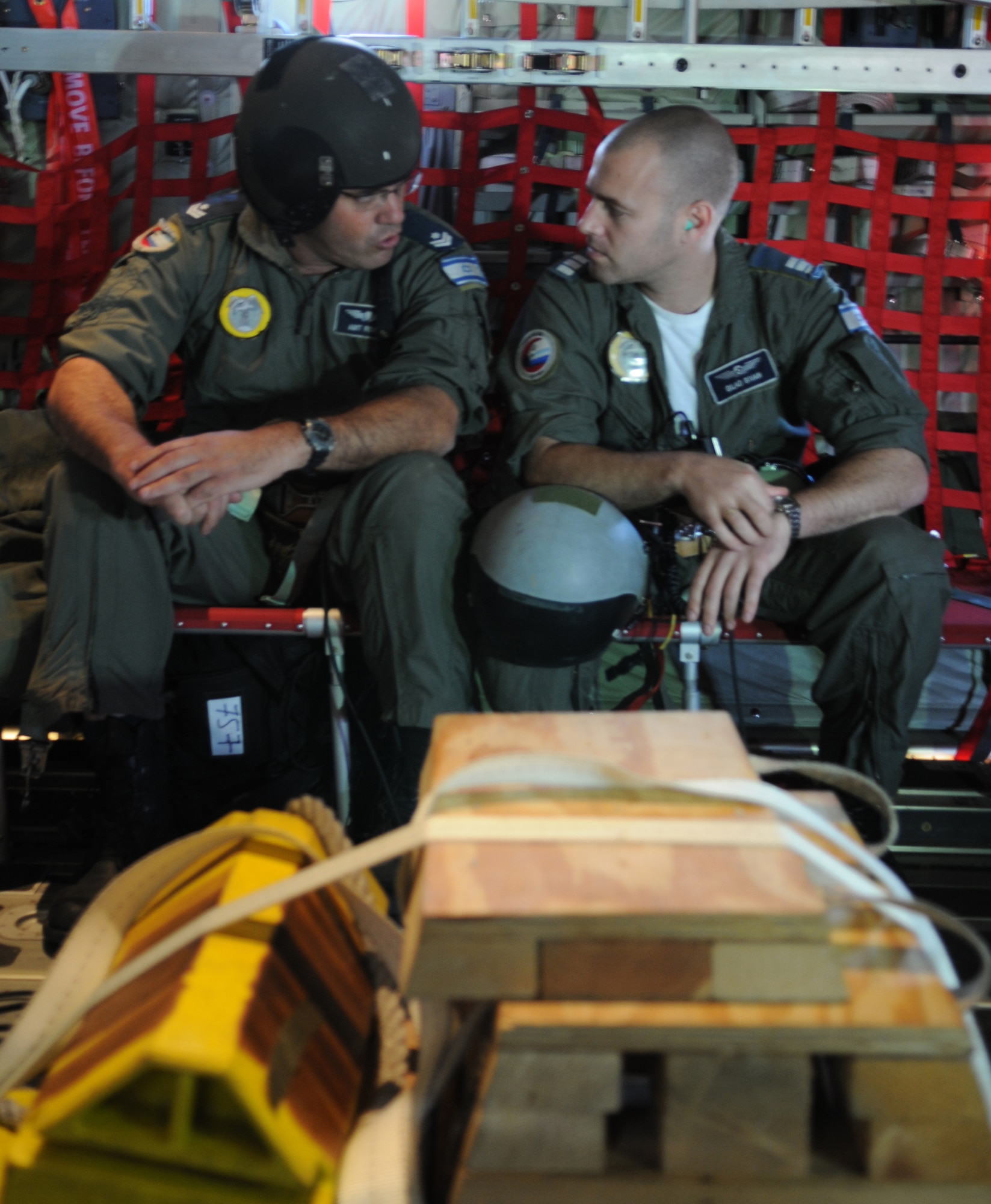 Israeli loadmasters prepare for takeoff in a U.S. C-130J Super Hercules Dec. 6, 2009, Nevatim Air Force Base. The Israeli Army had observers on every flight during the 10-day training exercise for Ramstein Air Base. The Israelis were eager to host Ramstein units to learn more about the C-130J models they will be getting in the next couple of years. (U.S. Air Force photo by Airman 1st Class Alexandria Mosness) 