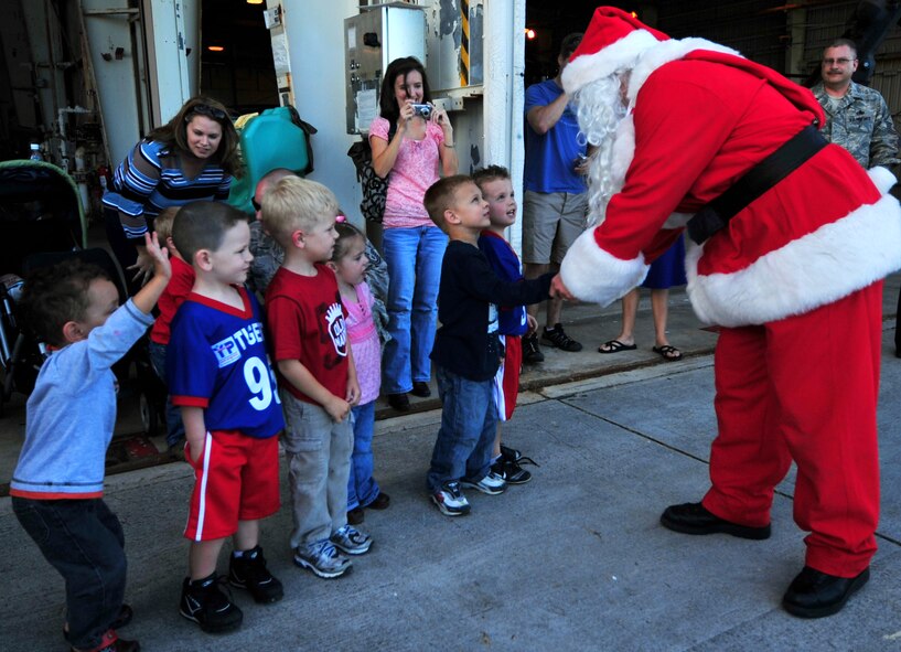 Santa Claus talks to children attending a holiday homecoming party at the 33rd Rescue Squadron maintenance hangar Dec. 10. The visit by Jolly old Saint Nick topped off a week when half of the "Jolly Green Giant" unit returned from a four-month deployment to Bagram Airfield, Afghanistan.  (Air Force/Tech. Sgt. Reynaldo Ramon)