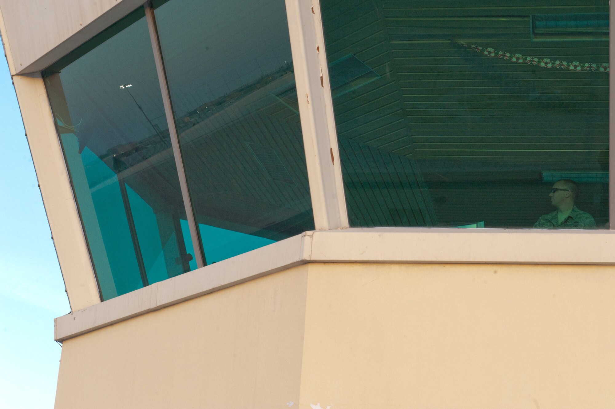 Staff Sgt. Lee Armstrong, 379th Expeditionary Operations Support Squadron, observes aircraft passing through Southwest Asia, Dec. 9, 2009. Sergeant Armstrong is an air traffic controller who expedites all aircraft taking off, landing, and transiting through the airfield here. (U.S. Air Force photo/Staff Sgt. Robert Barney) 