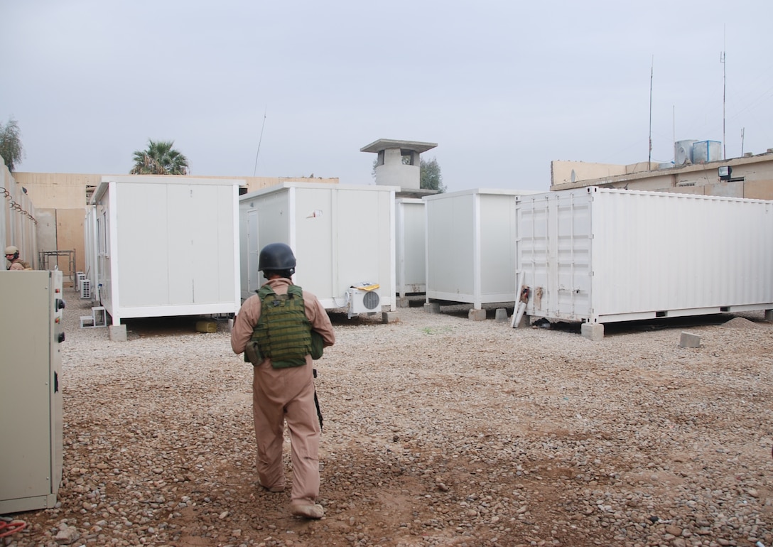 Containerized housing units will serve as living quarters, shower facilities and office space for expedient police stations under construction in northern Iraq. U.S. Army photo by Mike Scheck