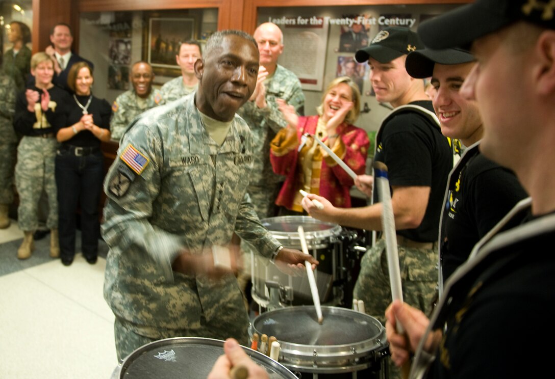 Gen. William "Kip" Ward, U.S. Africa Command Commander, shows West Point Army cadets how he plays the drums during a pep rally in the Pentagon, Dec. 11, 2009.  The rally is in anticipation of the annual Army-Navy football game, which will be played in Philadelphia, Dec. 12, 2009.  