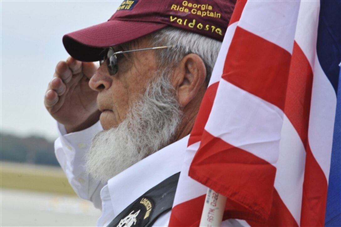 Willie Black, a member of the Patriot Guard Riders, salutes fallen warrior U.S. Army Staff Sgt. Briand Williams Dec. 3, 2009, at Moody Air Force Base, Ga. Williams, who had served in the Army since 2002, was killed in action in Iraq Nov. 22, 2009. He was assigned to the 3rd Infantry Division's 1st Battalion, 10th Field Artillery Regiment, 3rd Brigade Heavy Combat Team. 