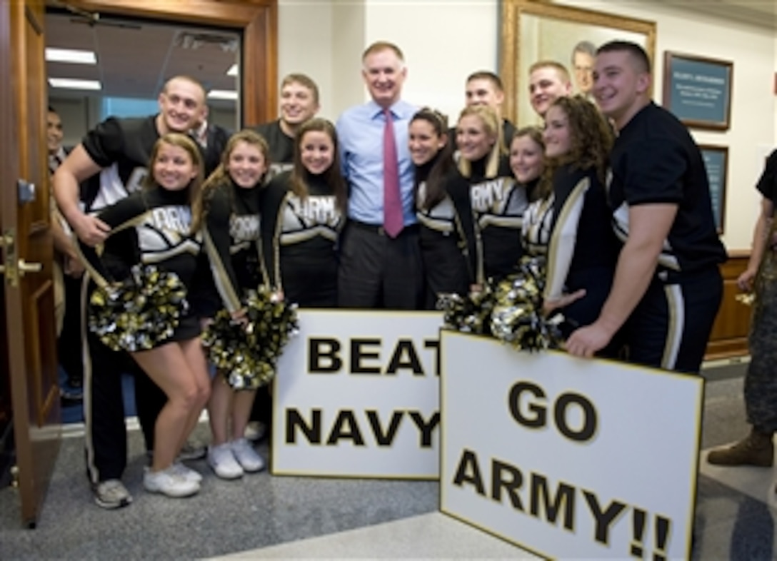 Deputy Secretary of Defense William J. Lynn III poses for a photo with students of the United States Military Academy at West Point in the Pentagon on Dec. 11, 2009.   The Army vs. Navy football game will be played at Lincoln Financial Field, Philadelphia, Penn., on Dec. 12, 2009.  