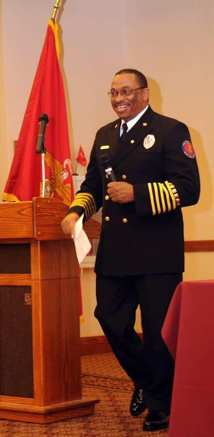 Station Fire Chief Patrick Bailey speaks to the crowd during his retirement ceremony at the Sonoran Pueblo at the Marine Corps Air Station in Yuma, Ariz., Dec. 11, 2009. A native of Glendora, Miss., Bailey retired after 34 years of service with the station fire department. Under Bailey’s leadership, the department received the Department of Defense Fire Department of the Year in 2007, and received several personal awards, including Fire Officer of the Year, throughout his career. Bailey plans to use his retirement to spend more time with his family.