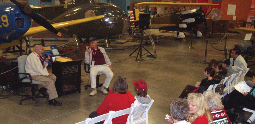 Frank Verano, a retired Navy chief radioman from Sun City, Calif., and John Ballard, a retired Navy chief pharmaceuticalmate from Hemet, Calif., both Pearl Harbor survivors, spoke to a crowd of about 30 people Dec. 6 at March Field Air Museum. The men spoke of their experiences on Dec. 7, 1941, when Pearl Harbor was attacked by the Japanese Navy which caused the U.S. to become militarily involved in World War II. Experiences from their time in the Navy were also recalled by the retired sailors whom, on occasion, answered questions posed by the crowd. The crowd described the dialogue as being “powerful” and “educational.” (Photo courtesy of March Field Air Museum)