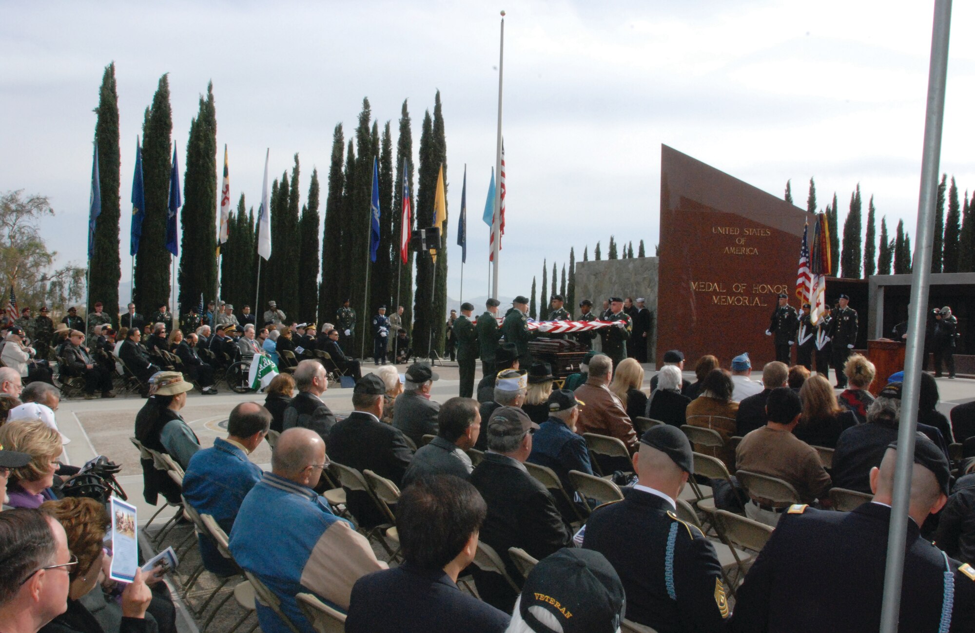 Community members pay their respects to Army Col. (Ret.) Lewis Lee Millett, Sr., during Dec. 5 memorial services at the Medal of Honor Memorial. Colonel Millett, a Medal of Honor recipient, was laid to rest in Riverside National Cemetery. (U.S. Air Force photos by Staff Sgt. Kevin T. Chandler)