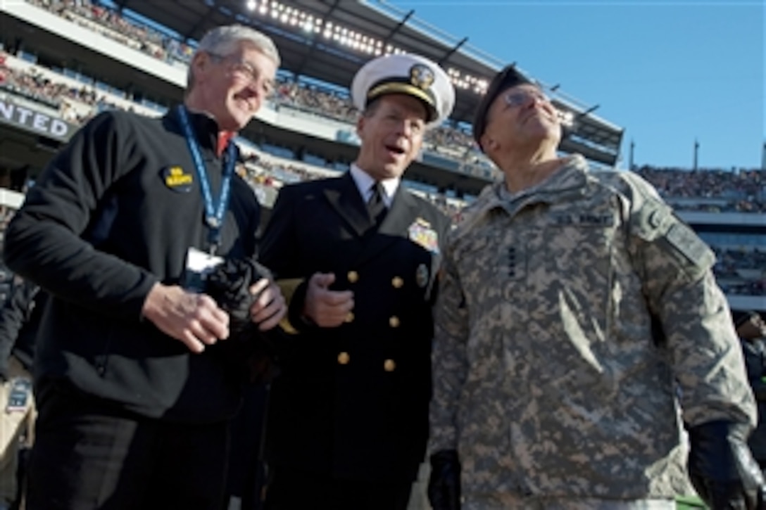 Army Secretary John McHugh; Navy Adm. Mike Mullen, chairman of the Joint Chiefs of Staff; and Army Chief of Staff Gen. George Casey attend the 110th the Army-Navy football game at Lincoln Financial Field in Philadelphia, Dec. 12, 2009. 