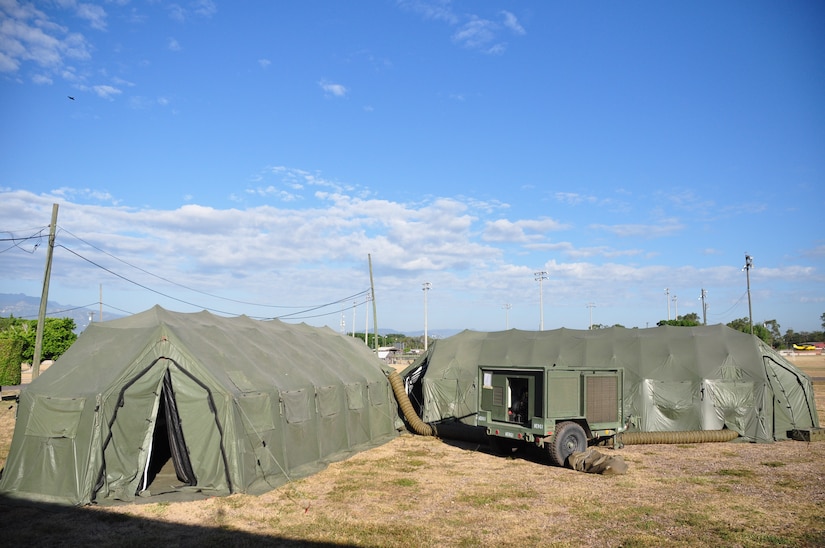 SOTO CANO AIR BASE, Honduras — Deployable Rapid-Assembly Shelter, or DRASH, tents were setup behind the base hospital for a mobile surgical team exercise here Dec. 10. The team itself is 100 percent mobile with a two-hour activation response time, and it can function alone for up to 72 hours. Their capabilities are to provide five major life- or limb-saving operations consecutively, and provide advanced trauma life support to 15 patients as well as providing limited post-operative recovery for surgical patients prior to evacuation (U.S. Air Force photo/Staff Sgt. Chad Thompson).