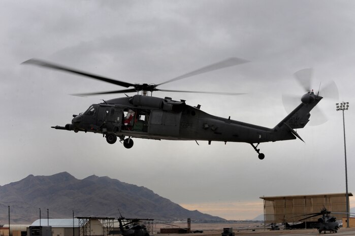 NELLIS AIR FORCE BASE, Nev.-- Santa Claus waves to a crowd of children from a HH-60G Pavehawk helicopter at the Nellis rescue community's annual children's Christmas party Dec. 12. 
(U.S. Air Force photo by Tech. Sgt. Michael R. Holzworth)