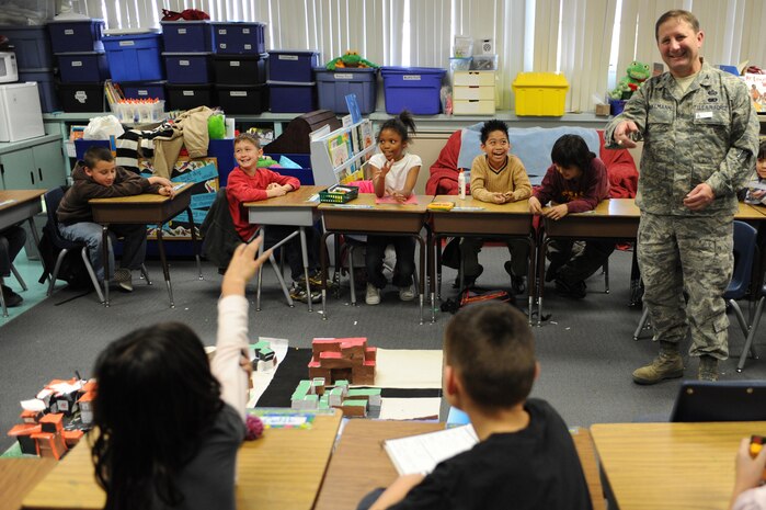 NELLIS AIR FORCE BASE, Nev.--  Col. Steven Winklmann, 99th Air Base Wing vice commander, answers questions from third grade students at Lomie Gray Heard Elementary School. Colonel Winklmann spent the afternoon as acting mayor of Candy Town, helping the children at the elementary school construct and place buildings throughout their make-believe community. The architectural project helped the children understand the many different aspects that go into planning and creating a community.
(U.S. Air Force photo by Tech. Sgt. Michael R. Holzworth)